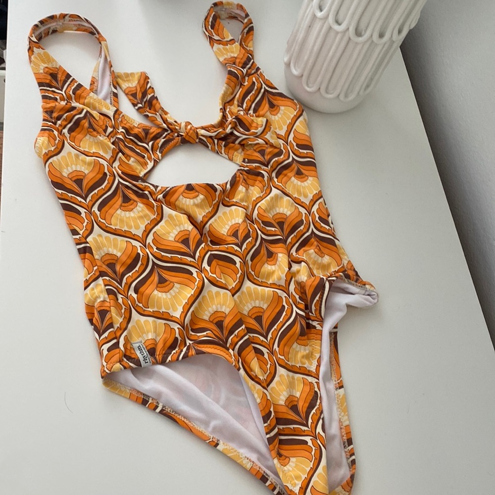 Adorable one piece retro print bathing suit by rhythm with cut out